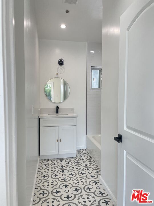 280 Grandview Street Pasadena, CA 91104 - Photo 28 of 34 a room with a sink and a mirror