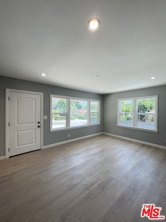 280 Grandview Street Pasadena, CA 91104 - Photo 4 of 34 an empty room with windows and entrance