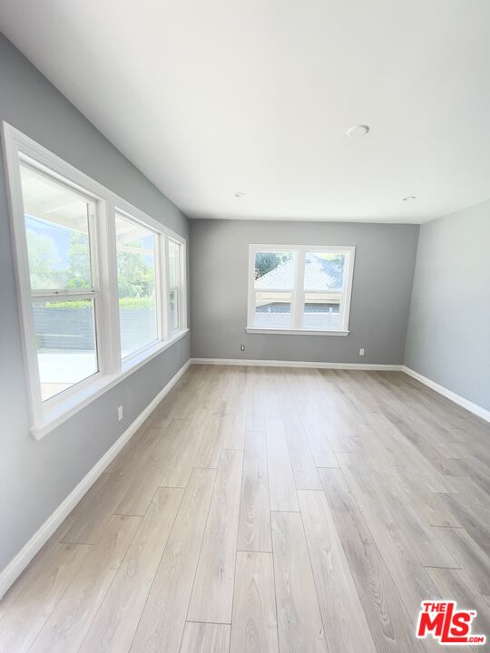 280 Grandview Street Pasadena, CA 91104 - Photo 5 of 34 an empty room with wooden floor and windows