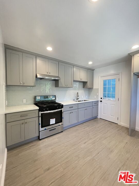 280 Grandview Street Pasadena, CA 91104 - Photo 6 of 34 a kitchen with stainless steel appliances granite countertop a sink and cabinets