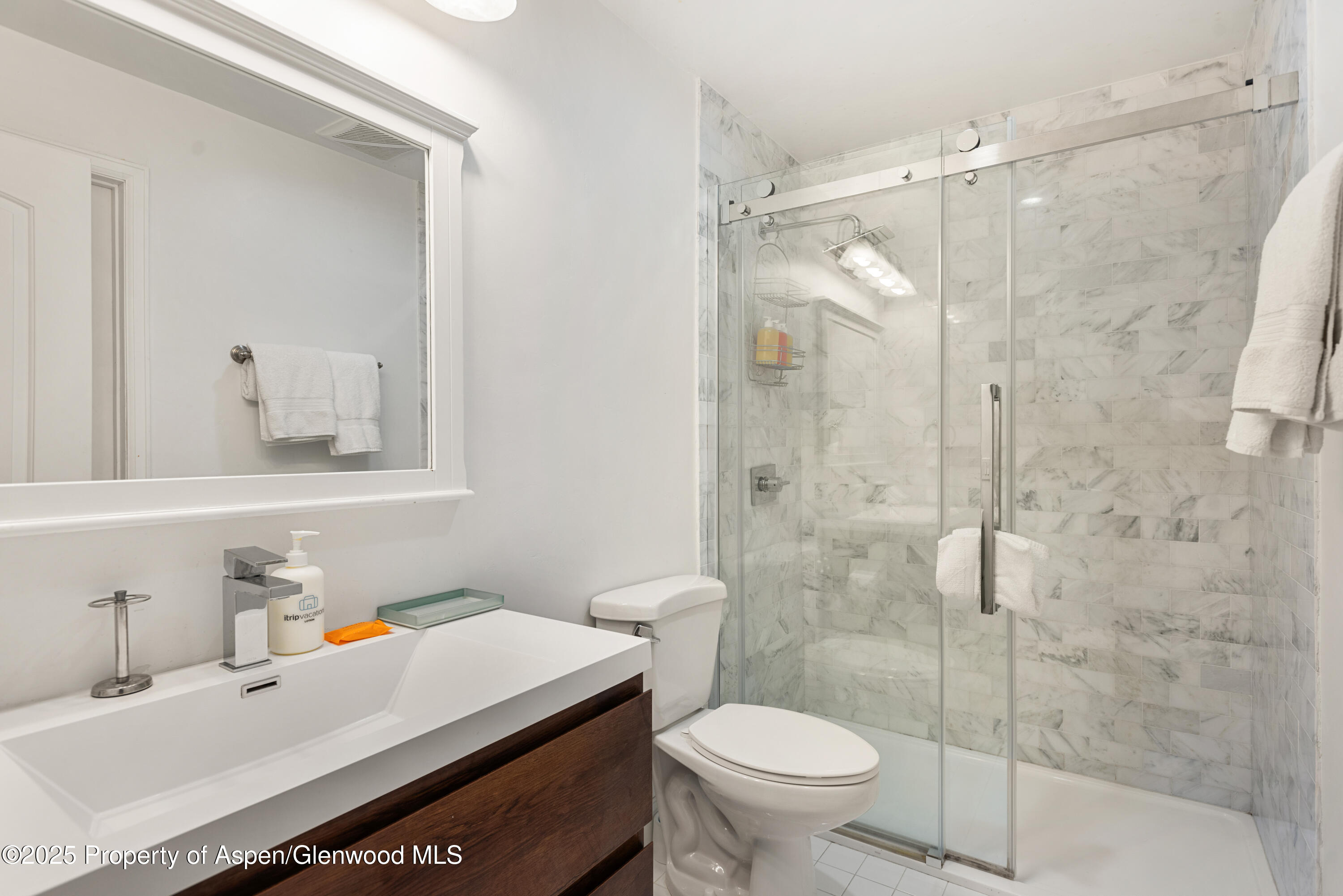 35 Upper Woodbridge Road, Unit 34CD Snowmass Village, CO 81615 - Photo 13 of 22 a bathroom with a sink toilet and shower