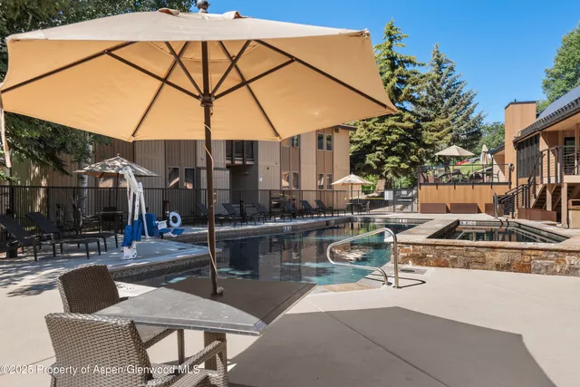 a view of a swimming pool with a patio