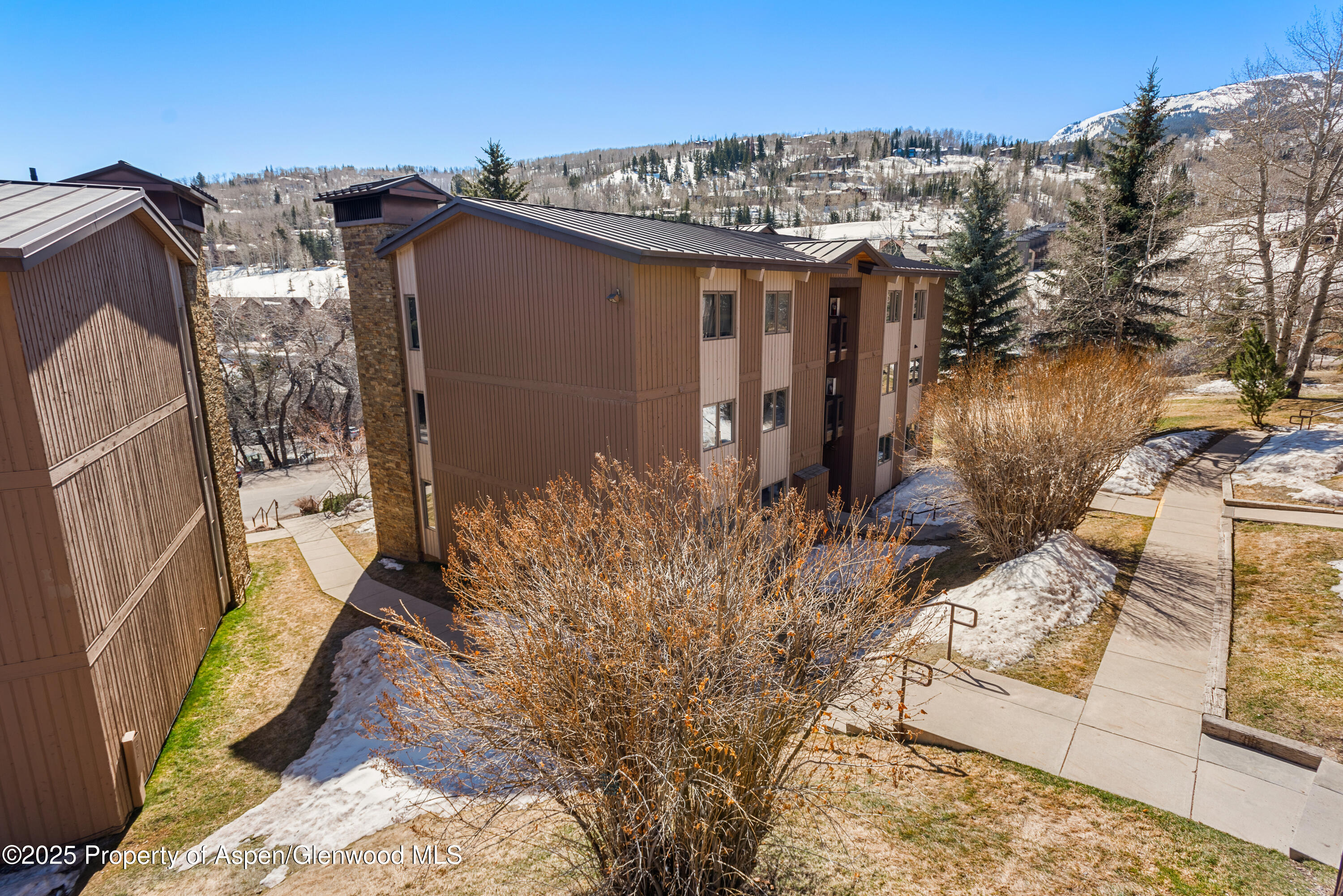 35 Upper Woodbridge Road, Unit 34CD Snowmass Village, CO 81615 - Photo 22 of 22 a view of a house with a outdoor space