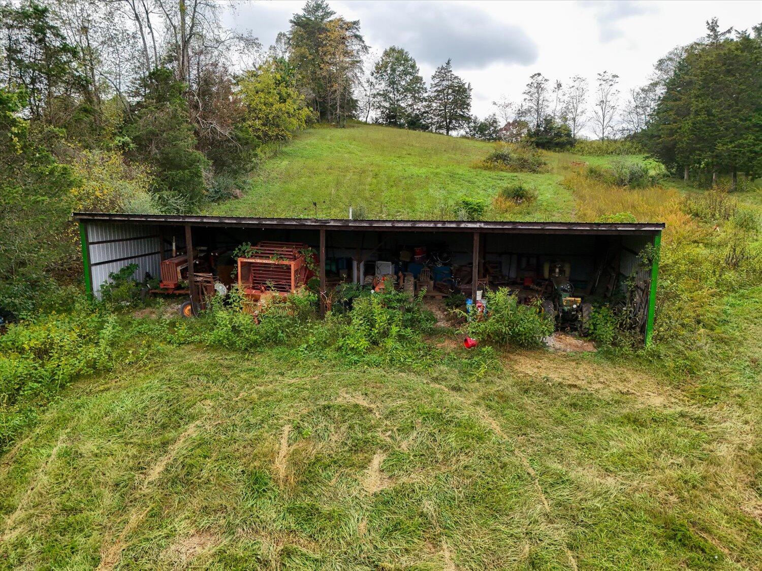 6481 Roanoke Road Fincastle, VA 24090 - Photo 14 of 47 a view of a house with a garden and plants