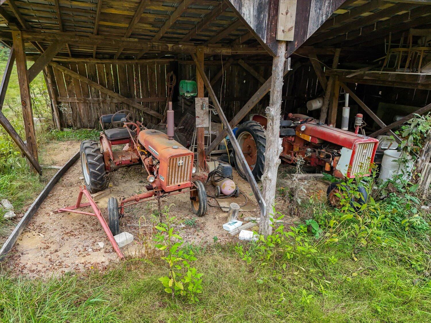 6481 Roanoke Road Fincastle, VA 24090 - Photo 10 of 47 a view of a backyard with table and chairs