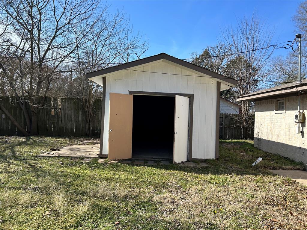 103 East Cayuga Drive Athens, TX 75751 - Photo 11 of 11 a view of house with backyard and trees