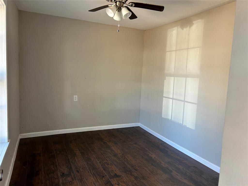 103 East Cayuga Drive Athens, TX 75751 - Photo 3 of 11 wooden floor in an empty room with a window