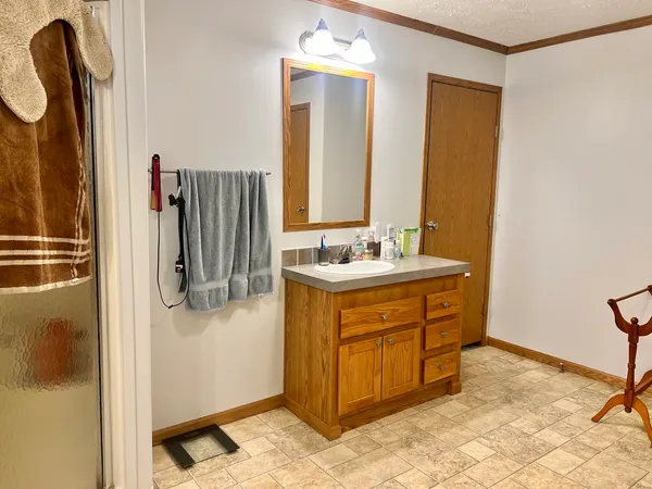 a bathroom with a sink double vanity and a mirror