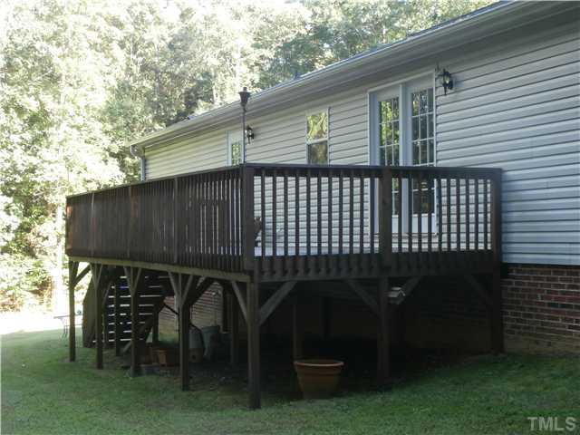 169 Kiser Hicks Road Roxboro, NC 27574 - Photo 5 of 21 Enjoy your backyard on this huge 29' x 10' deck!
