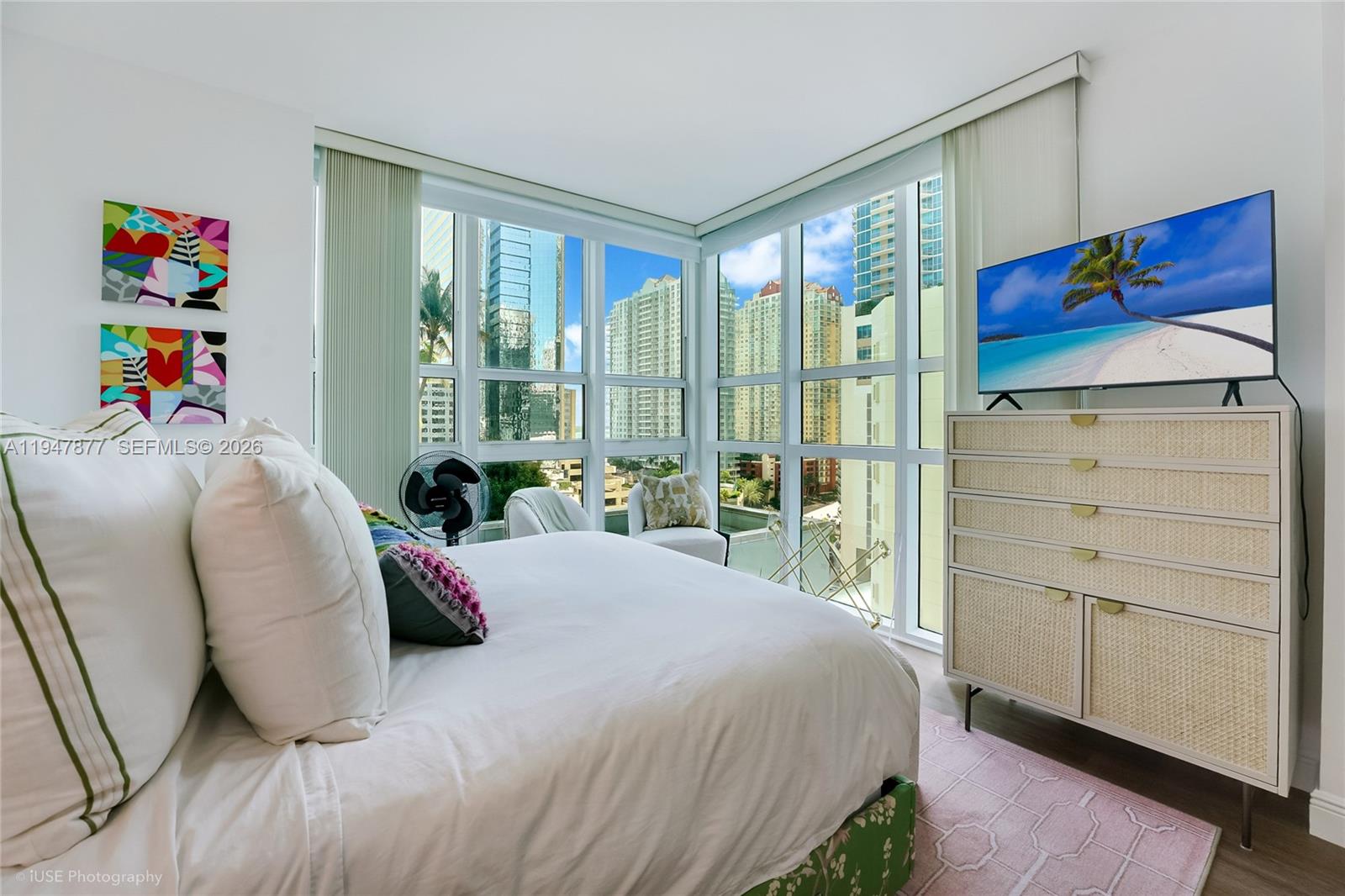 951 Brickell Avenue, Unit 1110 Miami, FL 33131 - Photo 13 of 28 a bedroom with a bed and a large window