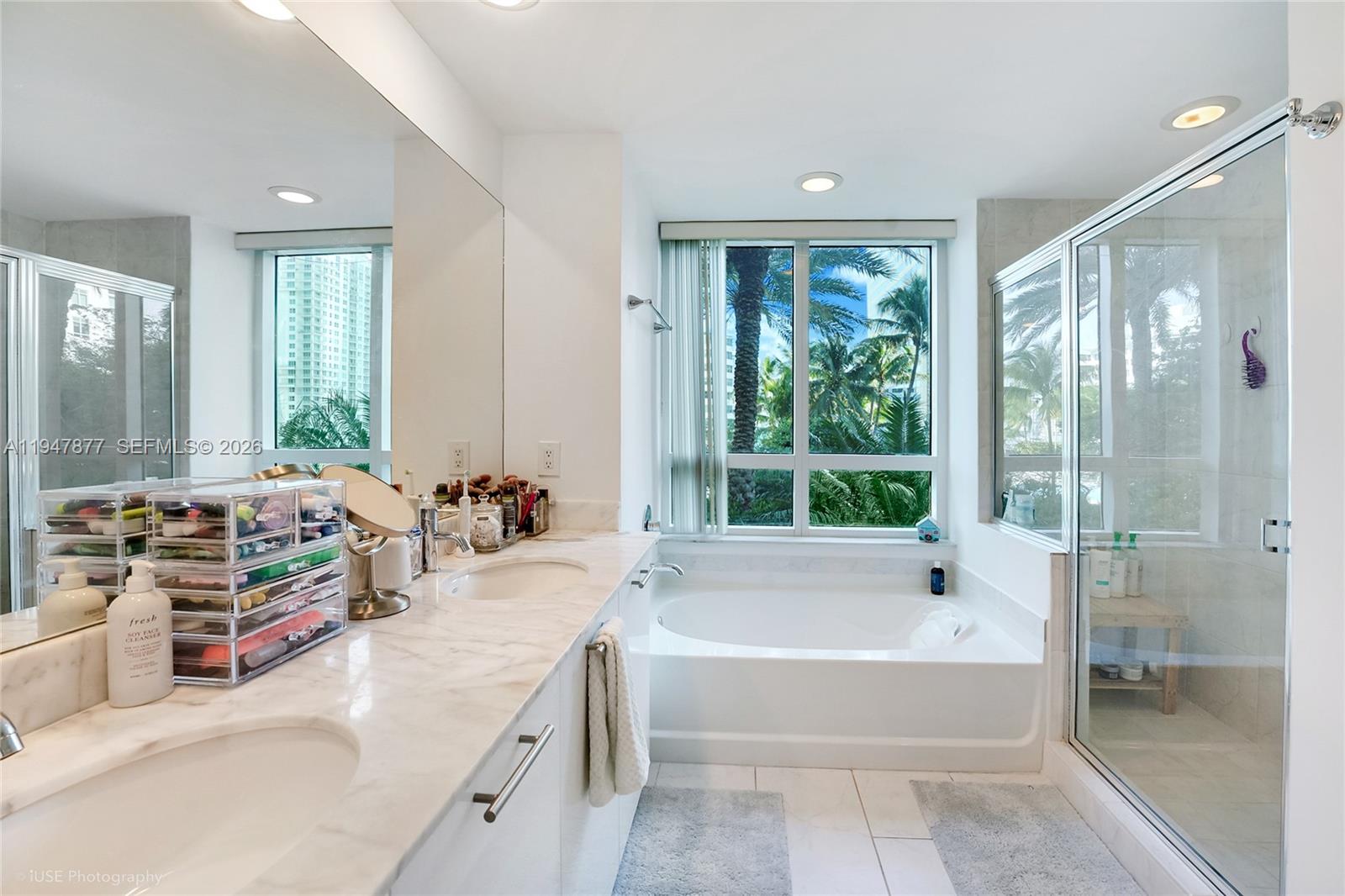 951 Brickell Avenue, Unit 1110 Miami, FL 33131 - Photo 15 of 28 a spacious bathroom with a large tub and shower