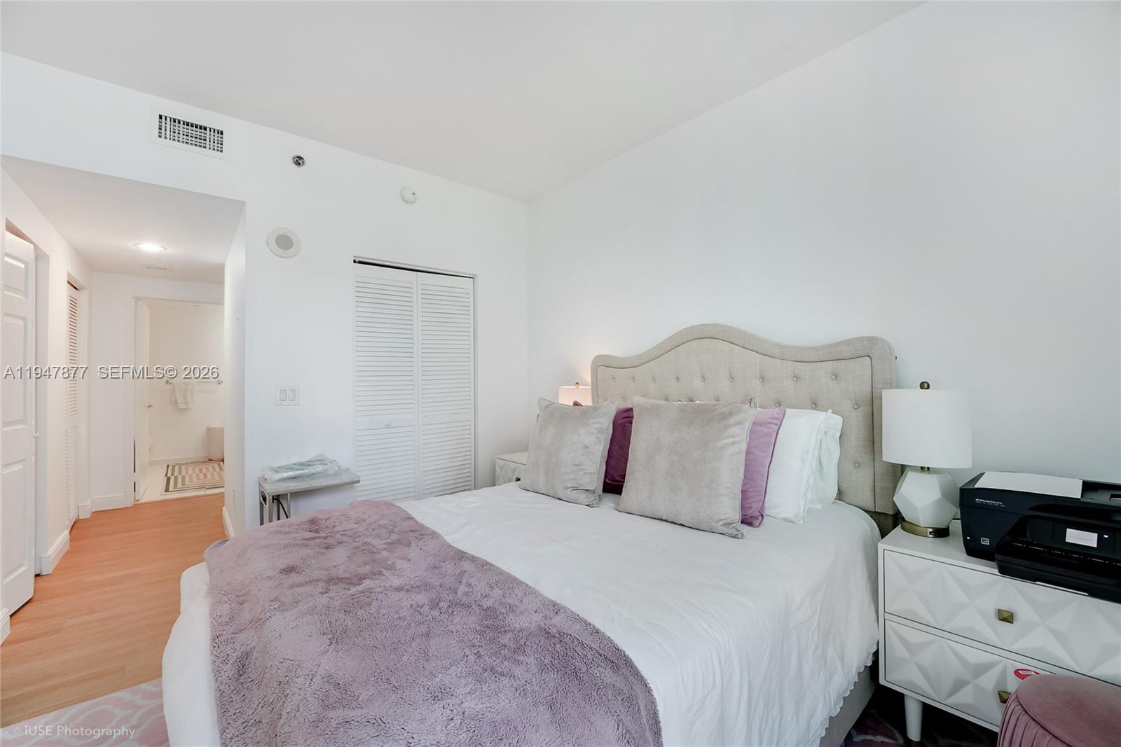 951 Brickell Avenue, Unit 1110 Miami, FL 33131 - Photo 18 of 28 a bedroom with a bed and a closet