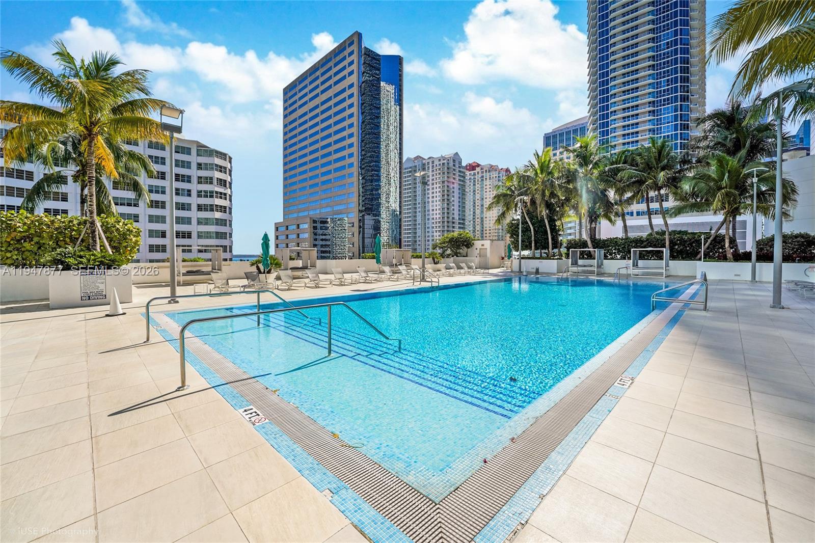 951 Brickell Avenue, Unit 1110 Miami, FL 33131 - Photo 25 of 28 a view of a swimming pool with chairs