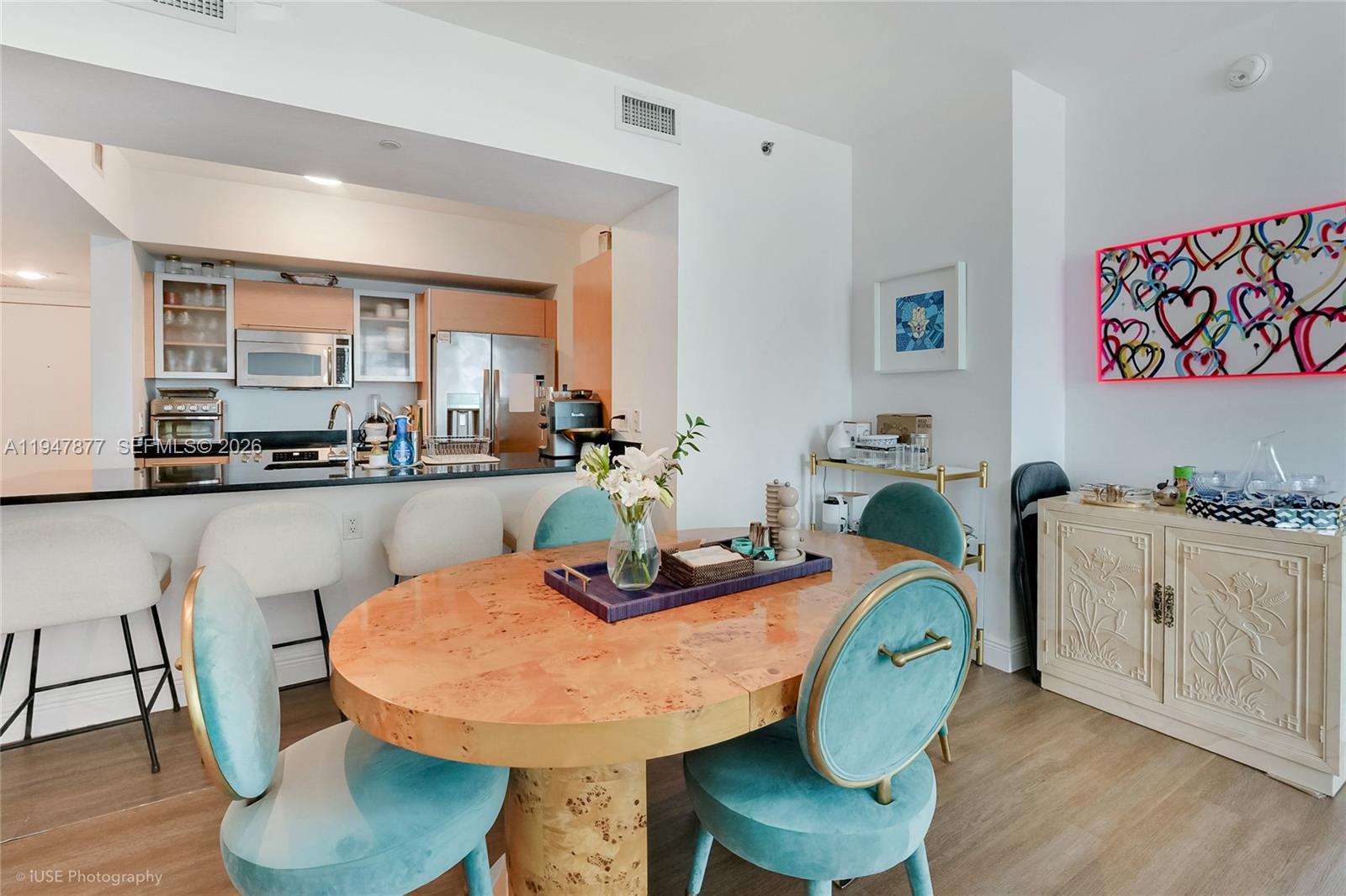 951 Brickell Avenue, Unit 1110 Miami, FL 33131 - Photo 6 of 28 a view of a dining room with furniture and wooden floor