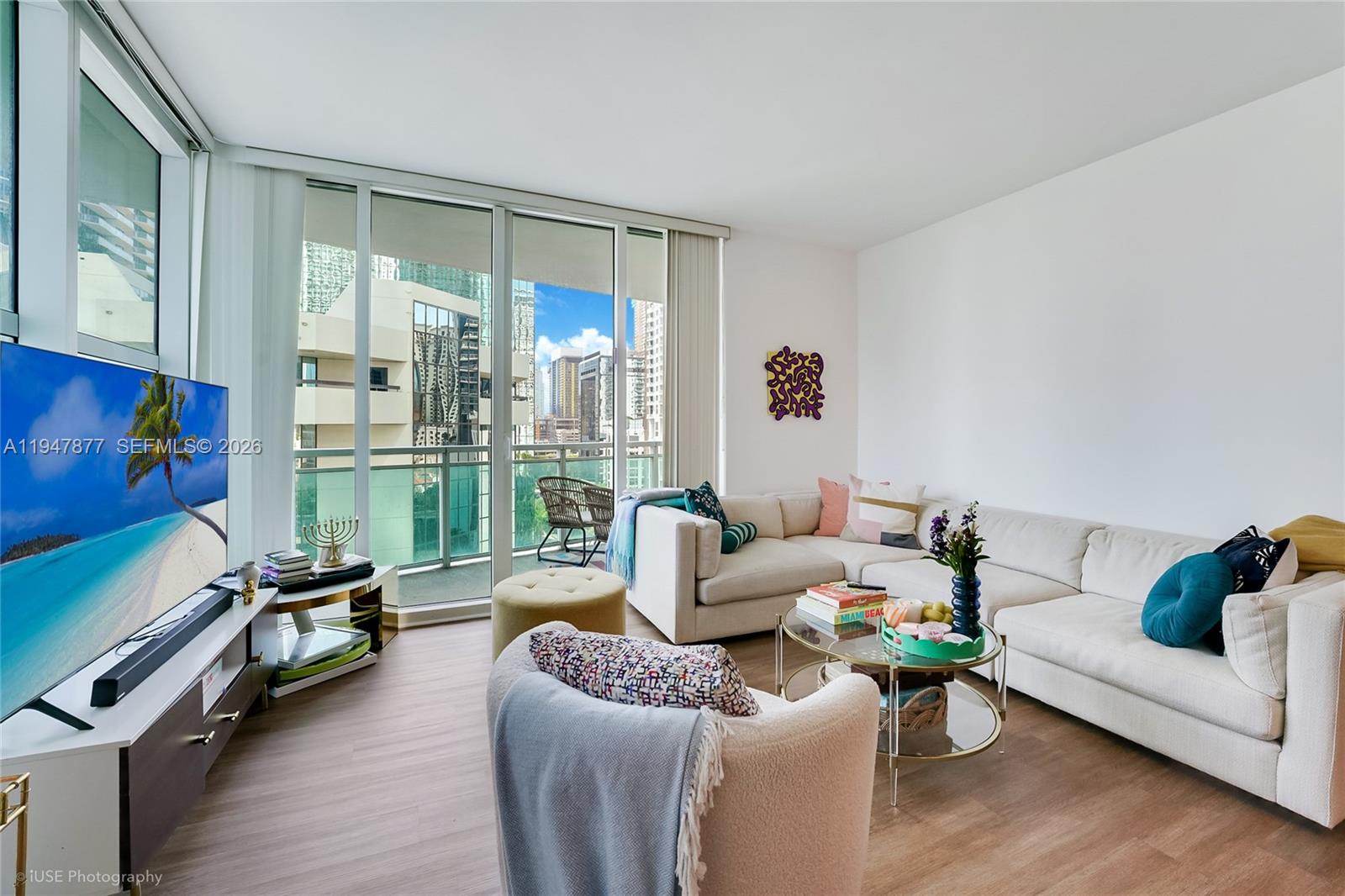 951 Brickell Avenue, Unit 1110 Miami, FL 33131 - Photo 8 of 28 a living room with furniture and a large window