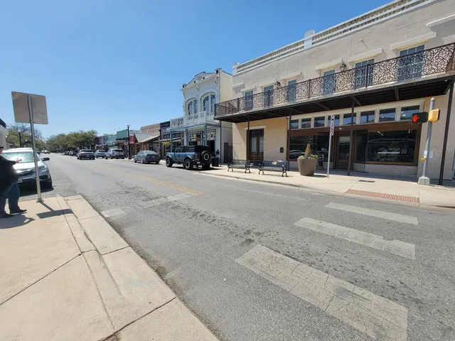 a front view of a building and a yard