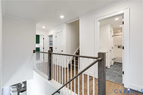 a view of a hallway view with staircase