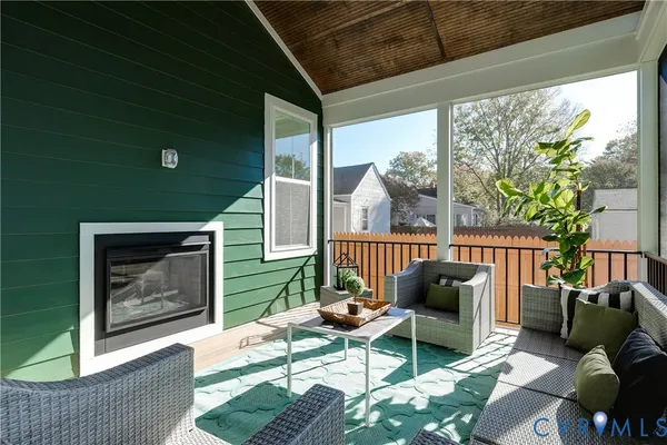 a balcony with furniture and a garden