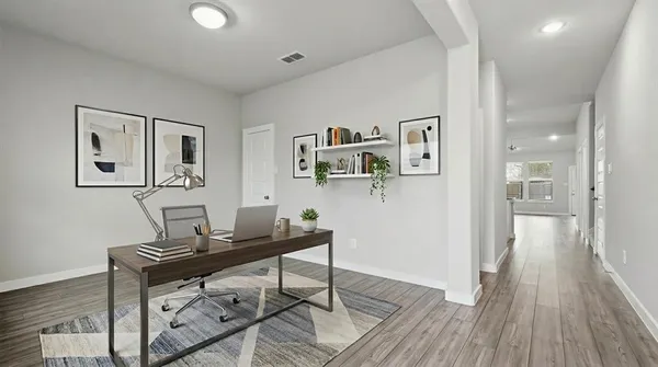 a workspace with furniture and wooden floor