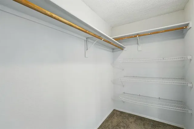 a view of a room with racks on the wall