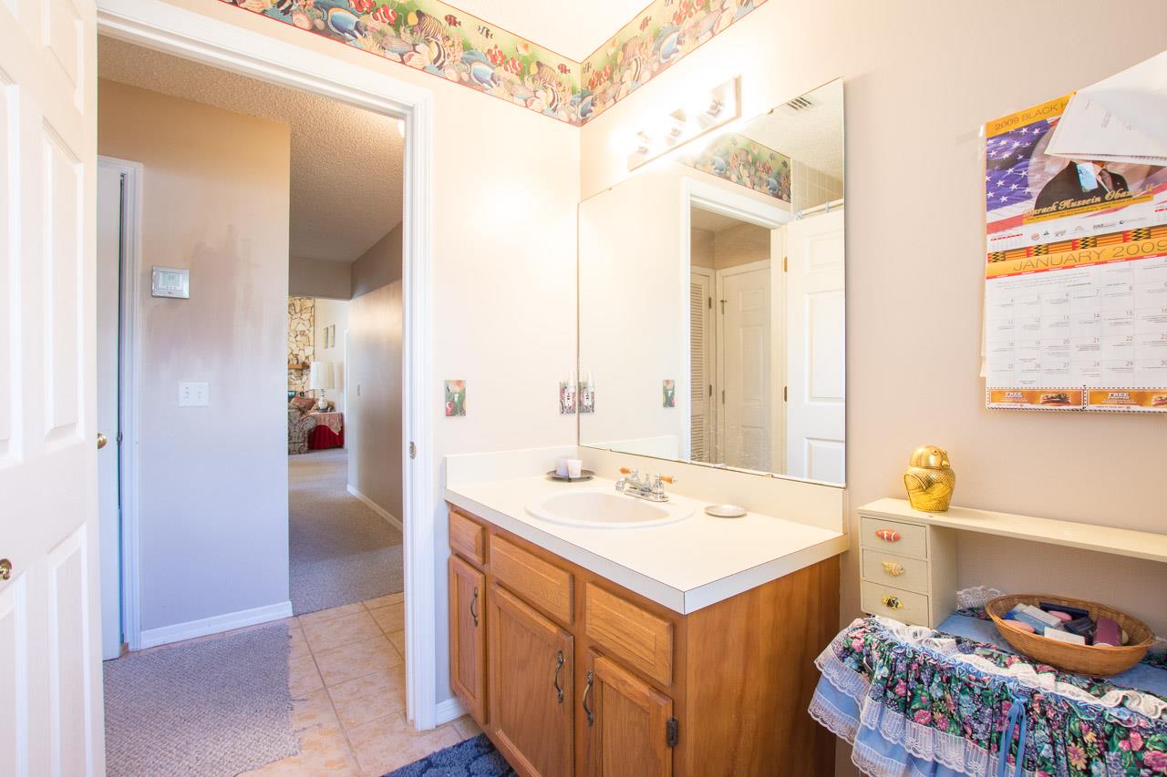 174 Segovia Road St. Augustine, FL 32086 - Photo 19 of 40 a bathroom with a sink and a mirror