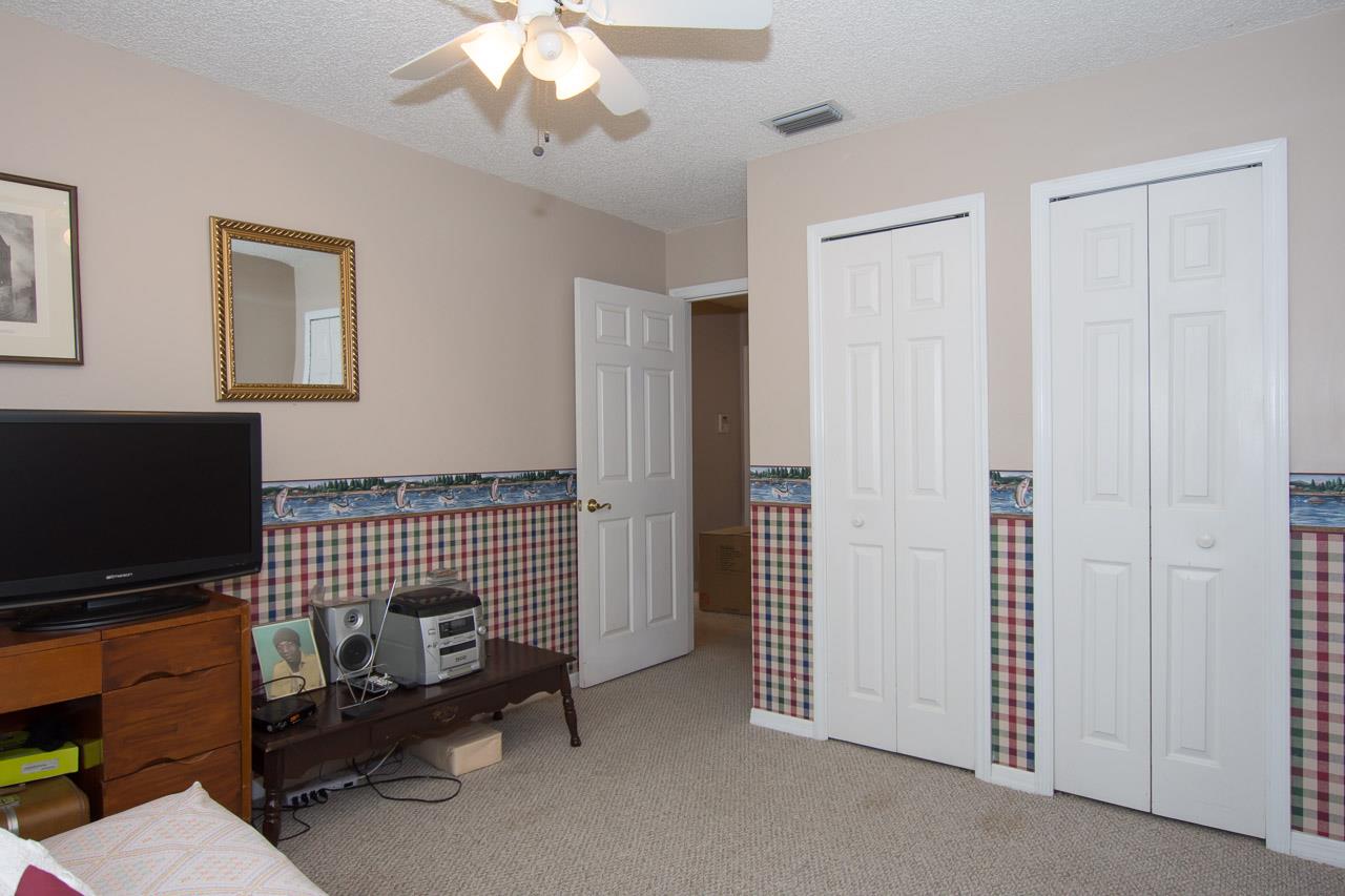 174 Segovia Road St. Augustine, FL 32086 - Photo 20 of 40 a view of a livingroom with furniture and a flat screen tv