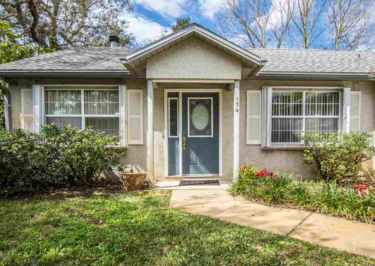 174 Segovia Road St. Augustine, FL 32086 - Photo 2 of 40 a view of a house with potted plants and a large window