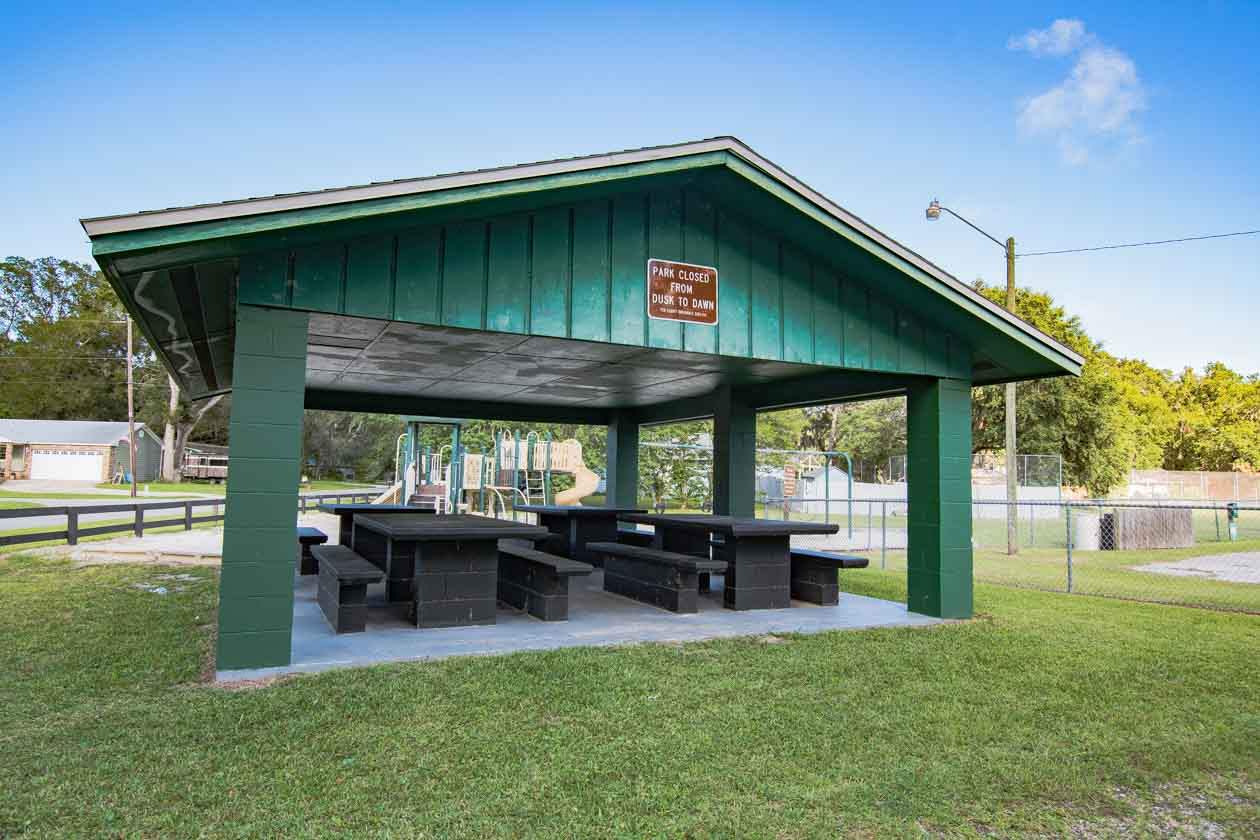 174 Segovia Road St. Augustine, FL 32086 - Photo 35 of 40 a backyard of a house with table and chairs