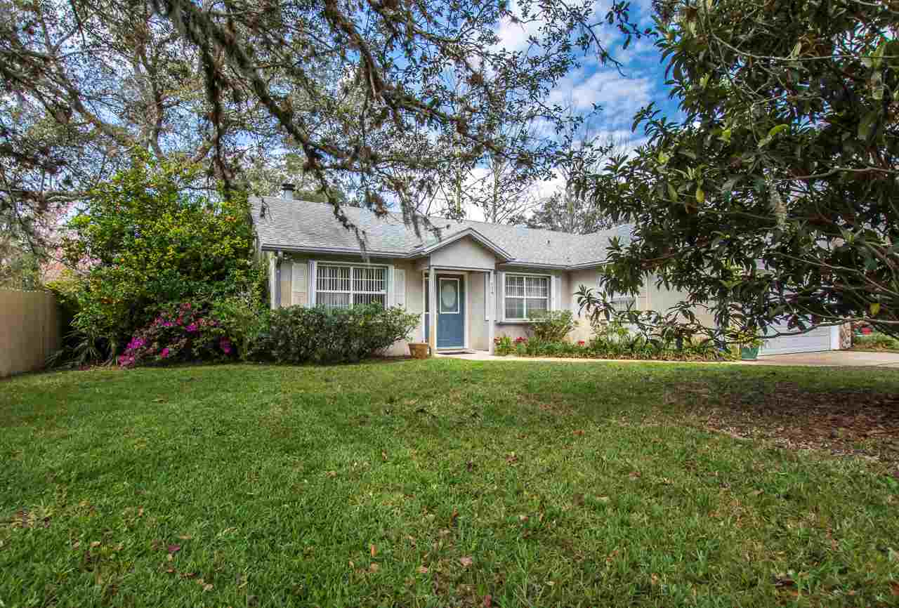 174 Segovia Road St. Augustine, FL 32086 - Photo 4 of 40 a front view of a house with yard and green space