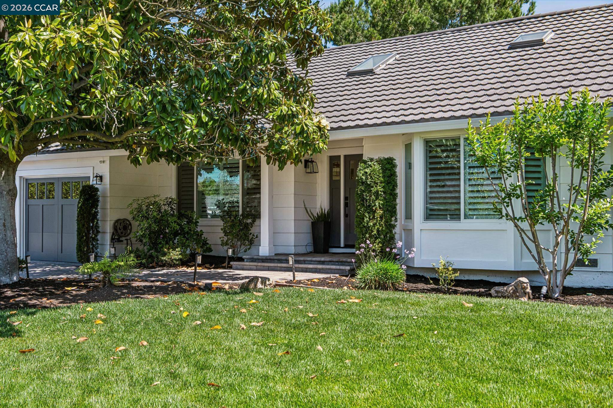 2941 Roundhill Road Alamo, CA 94507 - Photo 3 of 83 a front view of a house with garden