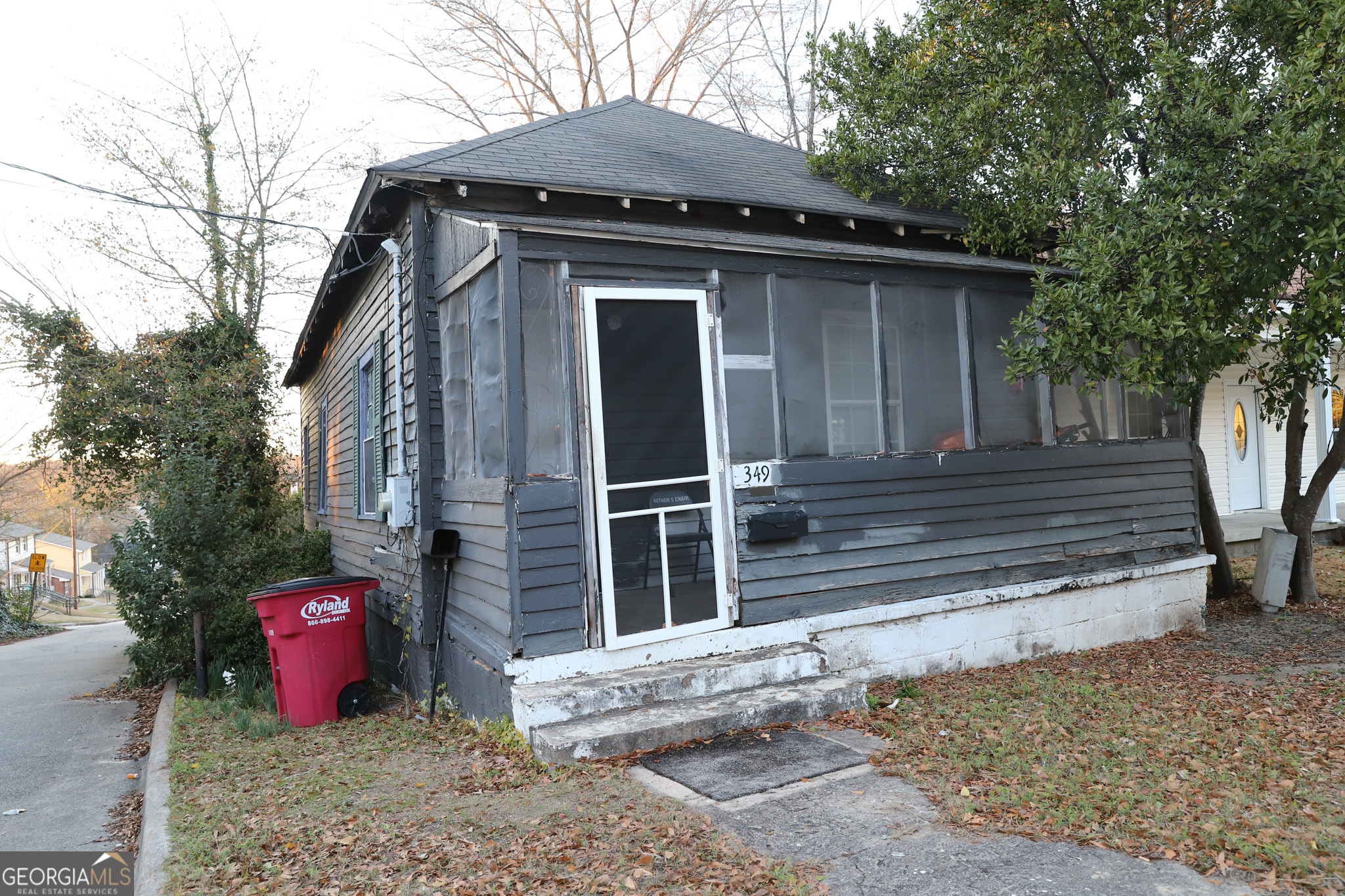 349 Madison Street Macon, GA 31201 - Photo 2 of 11 a front view of a house with parking space