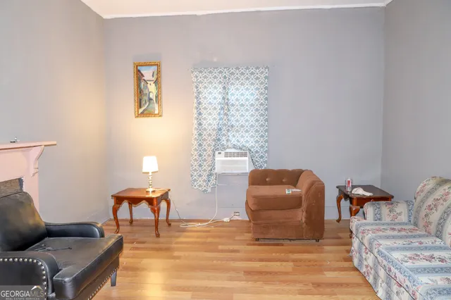 a living room with furniture and a chair