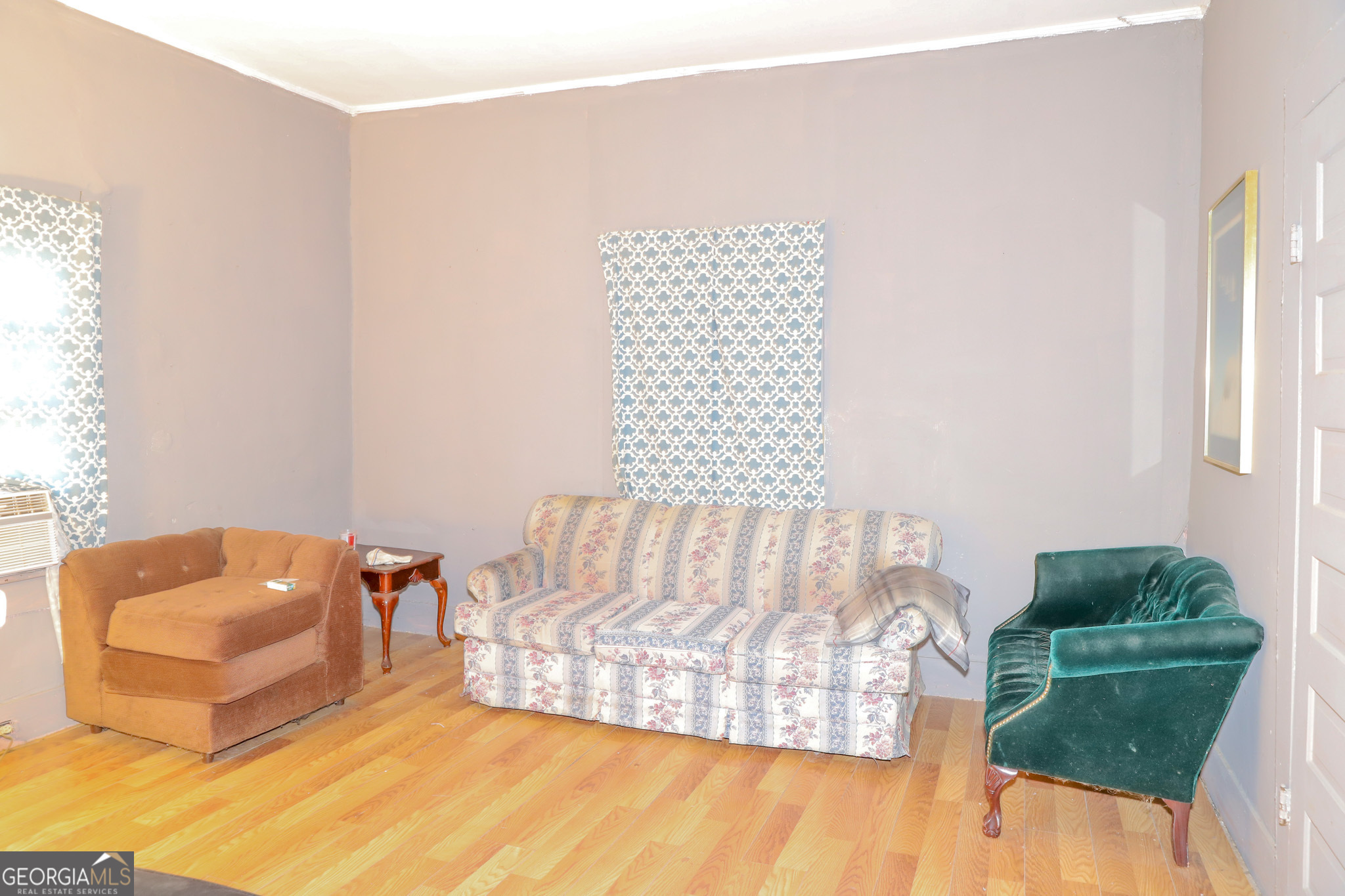 349 Madison Street Macon, GA 31201 - Photo 5 of 11 a living room with furniture and a couch