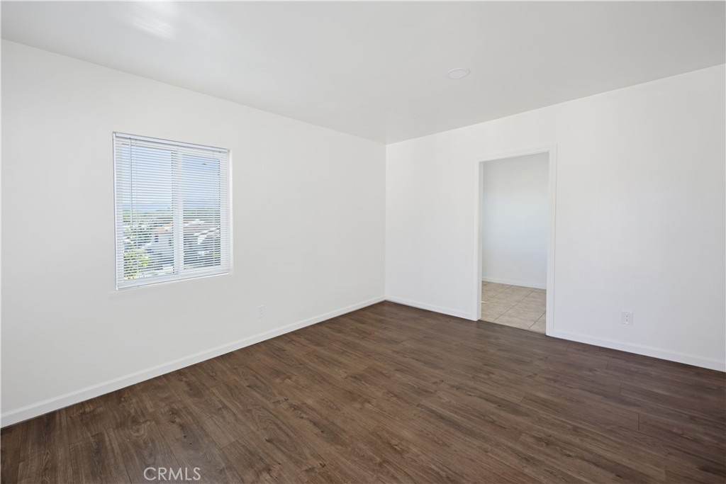 2770 Marengo Street Los Angeles, CA 90033 - Photo 3 of 9 a view of an empty room with wooden floor and a window