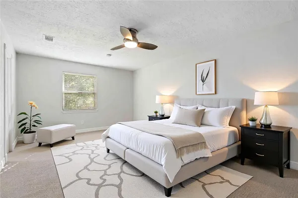 a view of empty room with ceiling fan