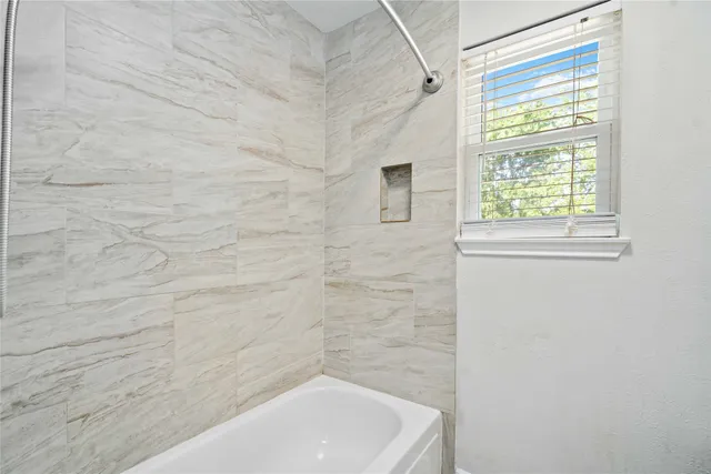 a bathroom with a bathtub