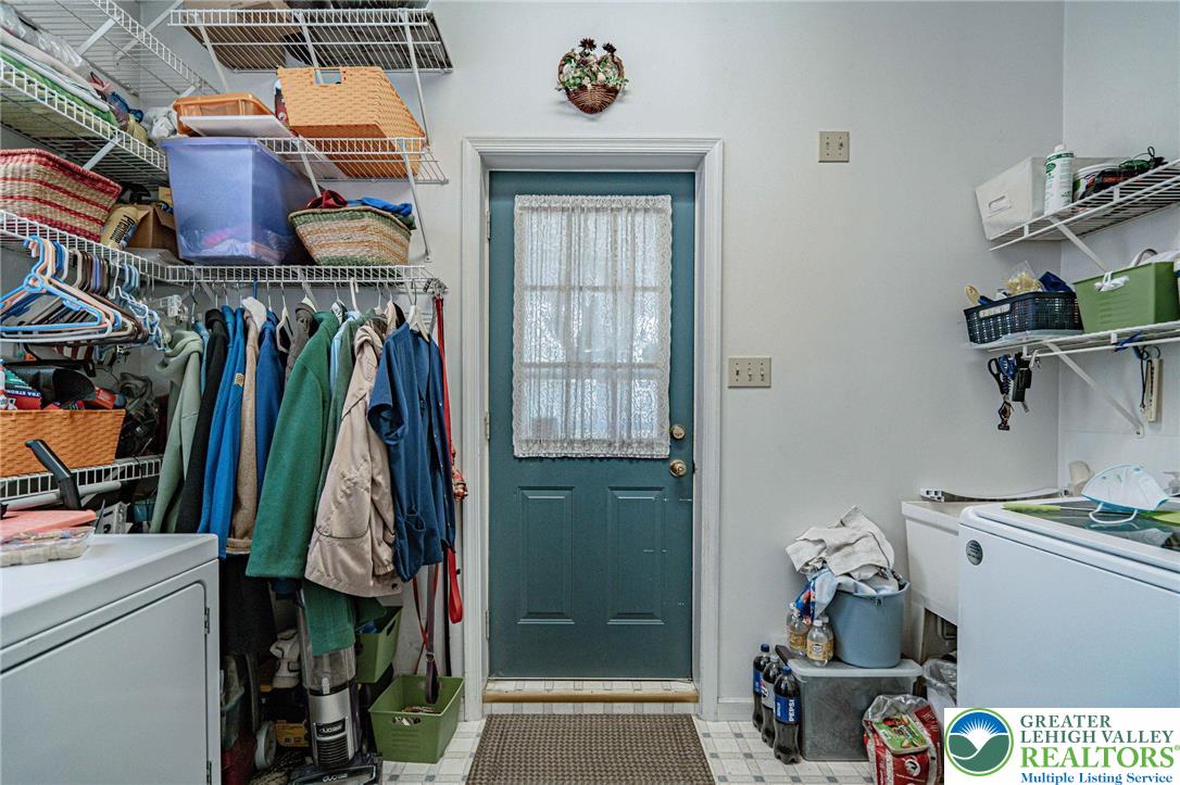 4250 Main Street Whitehall, PA 18052 - Photo 17 of 32 a view of walk in closet with clothes and shoes