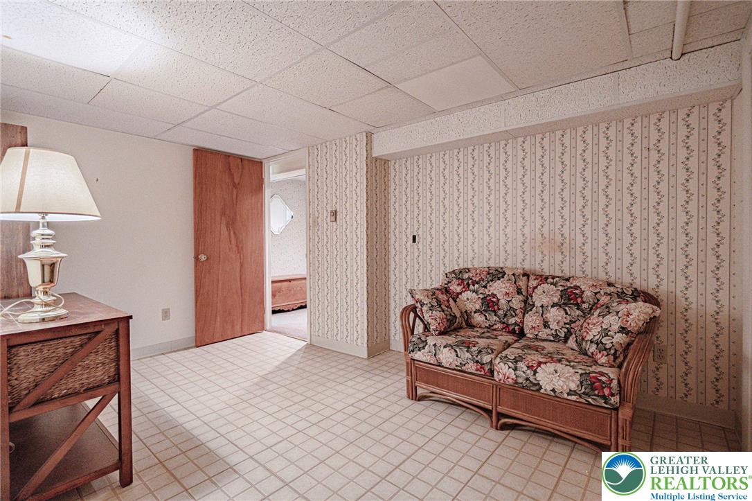 4250 Main Street Whitehall, PA 18052 - Photo 21 of 32 a bedroom with a bed and a lamp on dresser