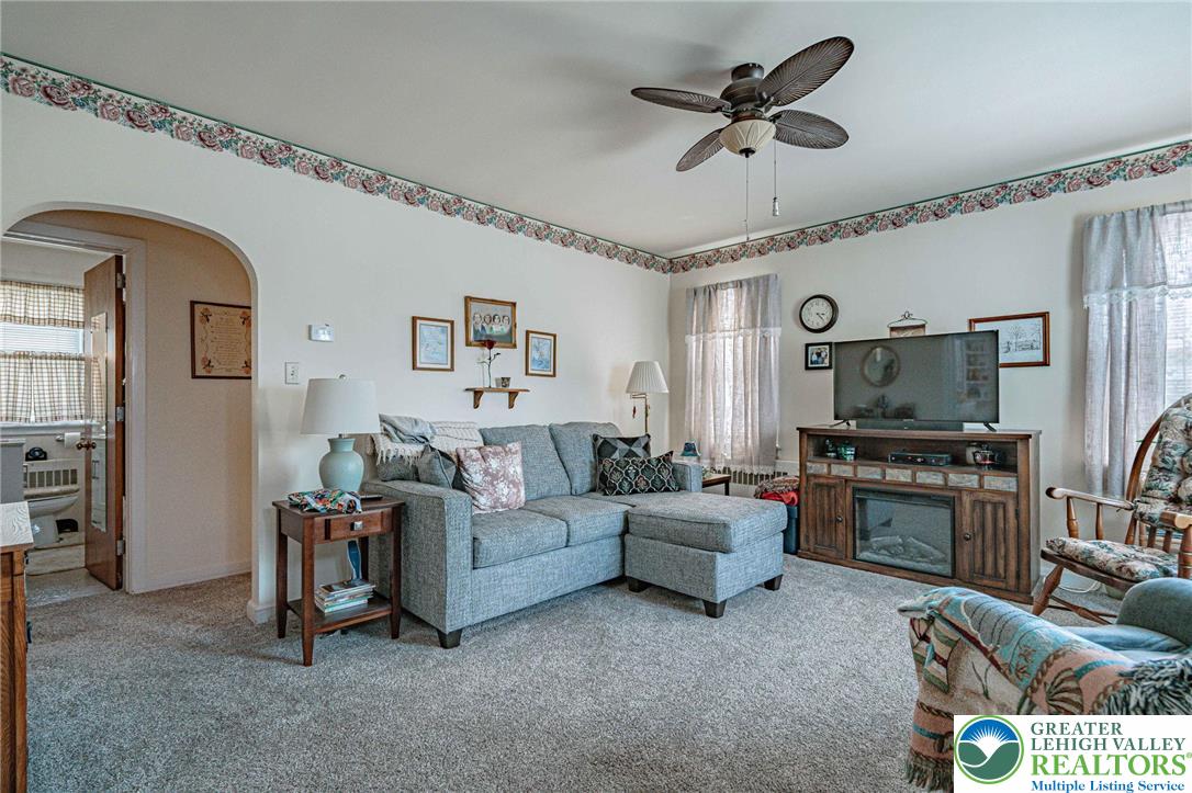 4250 Main Street Whitehall, PA 18052 - Photo 3 of 32 a living room with furniture and a flat screen tv