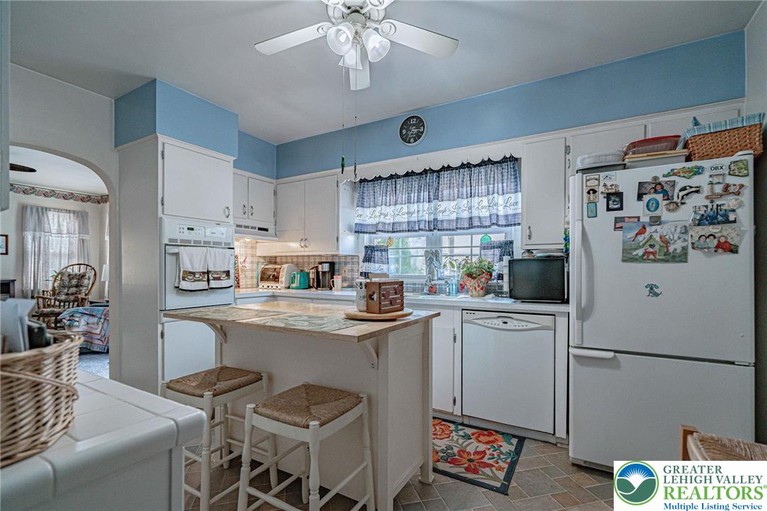4250 Main Street Whitehall, PA 18052 - Photo 10 of 32 a kitchen with cabinets and stainless steel appliances