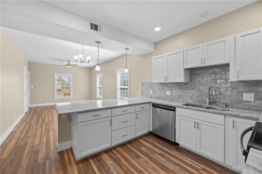 1017 12th Street Corpus Christi, TX 78404 - Photo 13 of 31 a kitchen with a sink cabinets and window