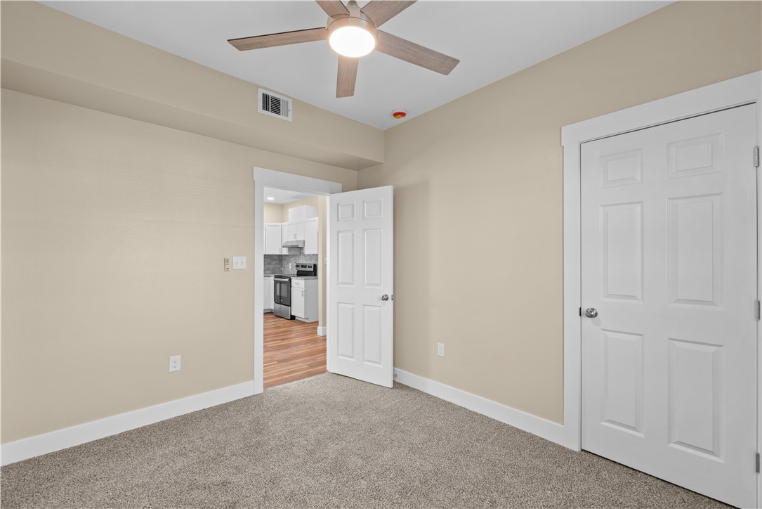 1017 12th Street Corpus Christi, TX 78404 - Photo 14 of 31 an empty room with a ceiling fan and a window