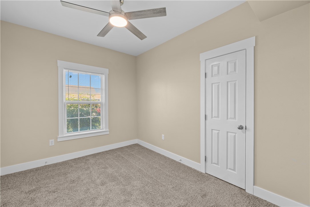 1017 12th Street Corpus Christi, TX 78404 - Photo 15 of 31 an empty room with a window and a fan