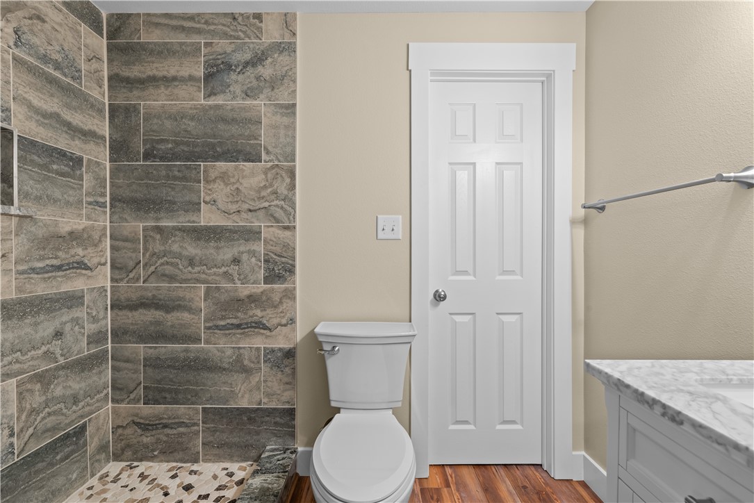 1017 12th Street Corpus Christi, TX 78404 - Photo 17 of 31 a bathroom with a toilet and a shower