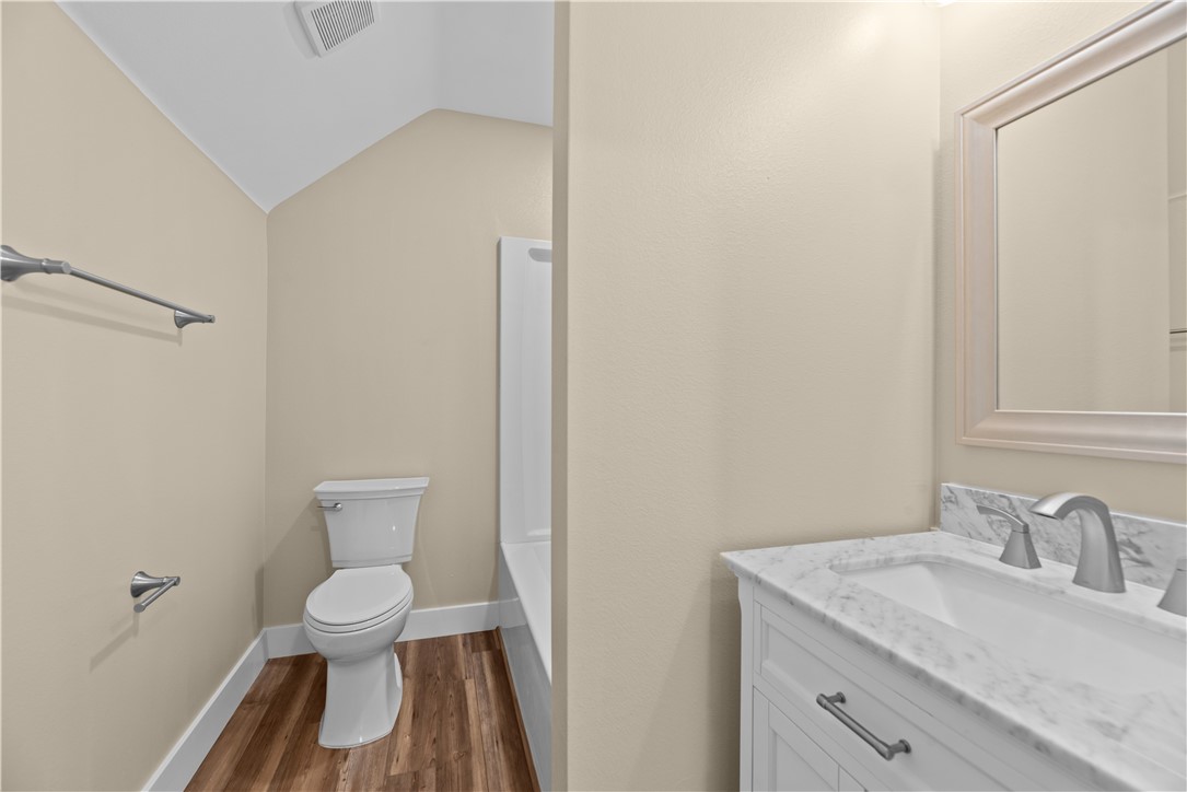 1017 12th Street Corpus Christi, TX 78404 - Photo 26 of 31 a bathroom with a sink and a toilet