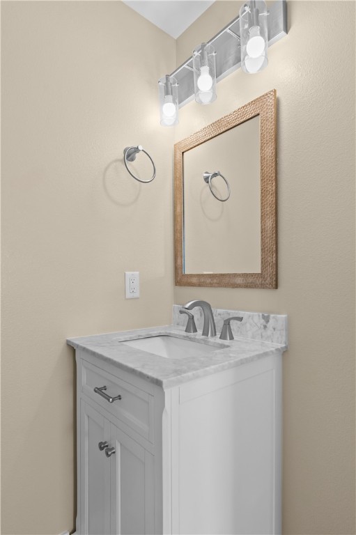 1017 12th Street Corpus Christi, TX 78404 - Photo 7 of 31 a bathroom with a sink vanity and a mirror