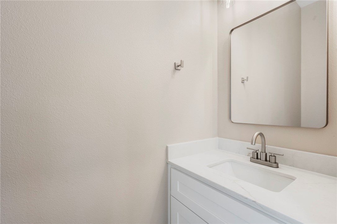 3213 Link Street, Unit 112 Bryan, TX 77801 - Photo 19 of 25 a bathroom with a sink and a mirror