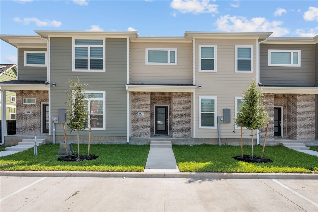 3213 Link Street, Unit 112 Bryan, TX 77801 - Photo 2 of 25 front view of house that has a yard