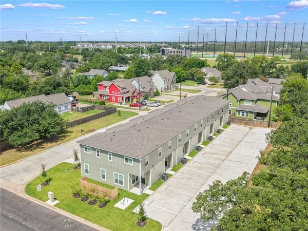 an aerial view of house with yard swimming pool and mountain view