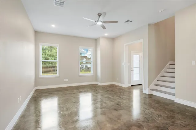 a view of an empty room with a window